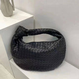 Große Schultertasche aus gewebtem veganem Leder